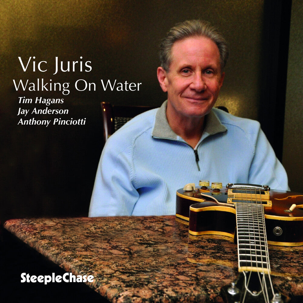 the album cover for Vic Juris - Walking on Water