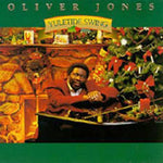 the album cover for Oliver Jones - Yuletide Swing