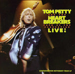 the album cover for Tom Petty & The Heartbreakers - Live: Pack Up the Plantation