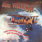 the album cover for Joe Walsh - The Smoker You Drink The Player You Get