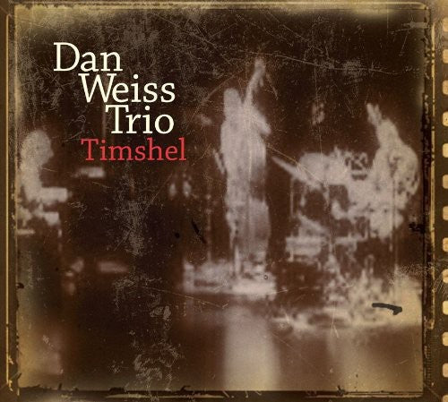 the album cover for Dan Weiss Trio - Timshell