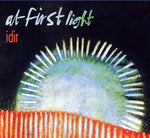 the album cover for At First Light - Idir