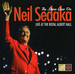 the album cover for Neil Sedaka - The Show Goes On