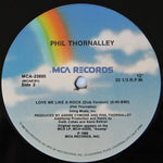 Phil Thornalley : Love Me Like A Rock (12", Single, Pin)