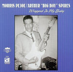 the album cover for Pejoe/Spires - Wrapped in My Baby