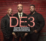 the album cover for De3 - Live At Maxwell's