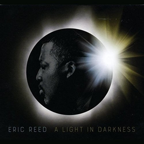 the album cover for Eric Reed - A Light In Darkness