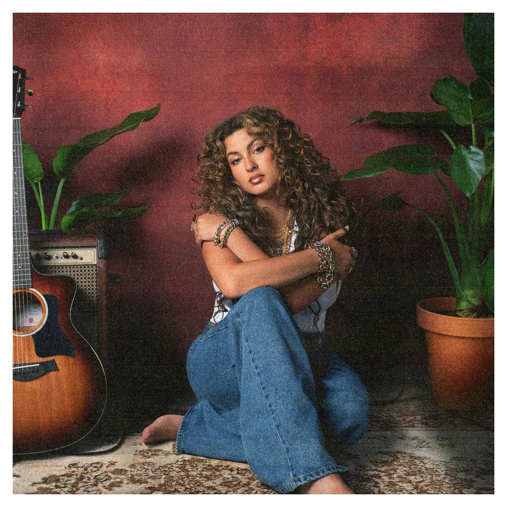 the album cover for Tori Kelly - God Must Really Love Me
