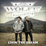 the album cover for Wolfe Brothers - Livin The Dream