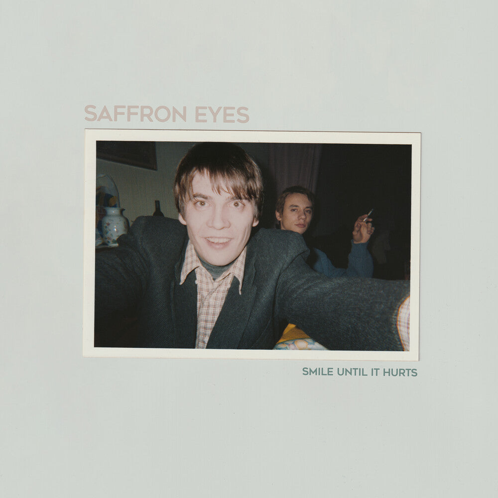 the album cover for Saffron Eyes - Smile Until It Hurts