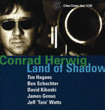 the album cover for Conrad Herwig - Land of Shadow