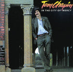 the album cover for Tom Chapin - In the City of Mercy