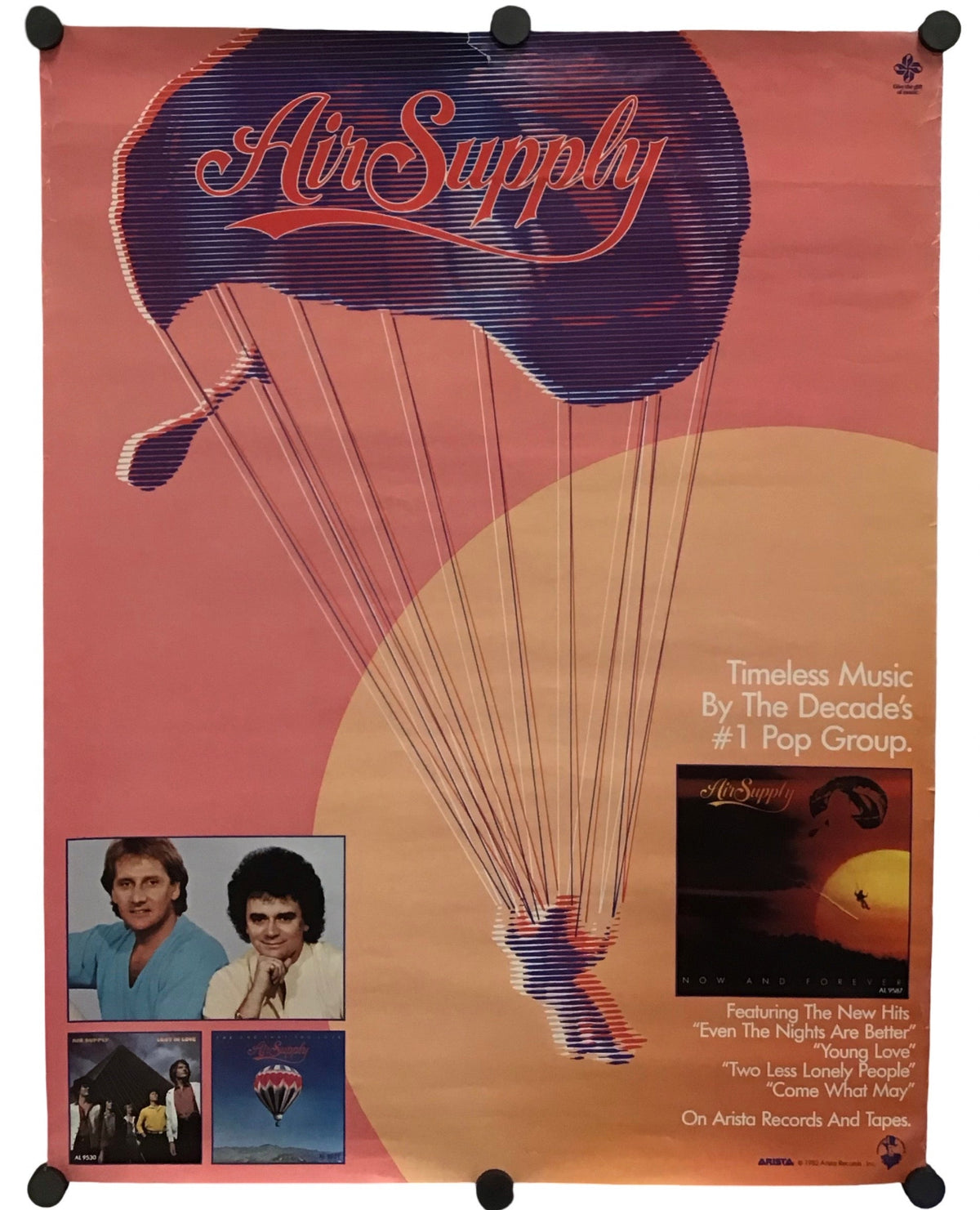Vintage Air Supply music poster featuring a large purple parachute graphic with the band name in red script, set against a peach and beige background with small inset photos and album artwork.