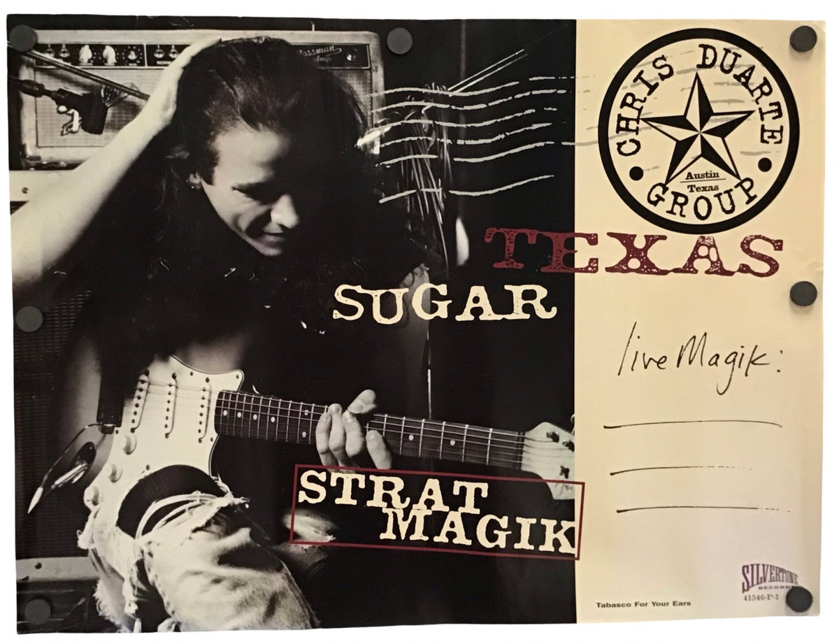 A vintage-style printed poster or sign featuring a black-and-white photo of a woman holding an electric guitar, with the text 'TEXAS SUGAR', 'STRAT MAGIK' on a cream background with printed lines for writing.