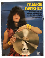 A vintage promotional poster for Sabian Cymbals featuring Frankie Banali of Quiet Riot, with the text 'FRANKIE SWITCHED' and a large photo of him holding a cymbal against a blue background.