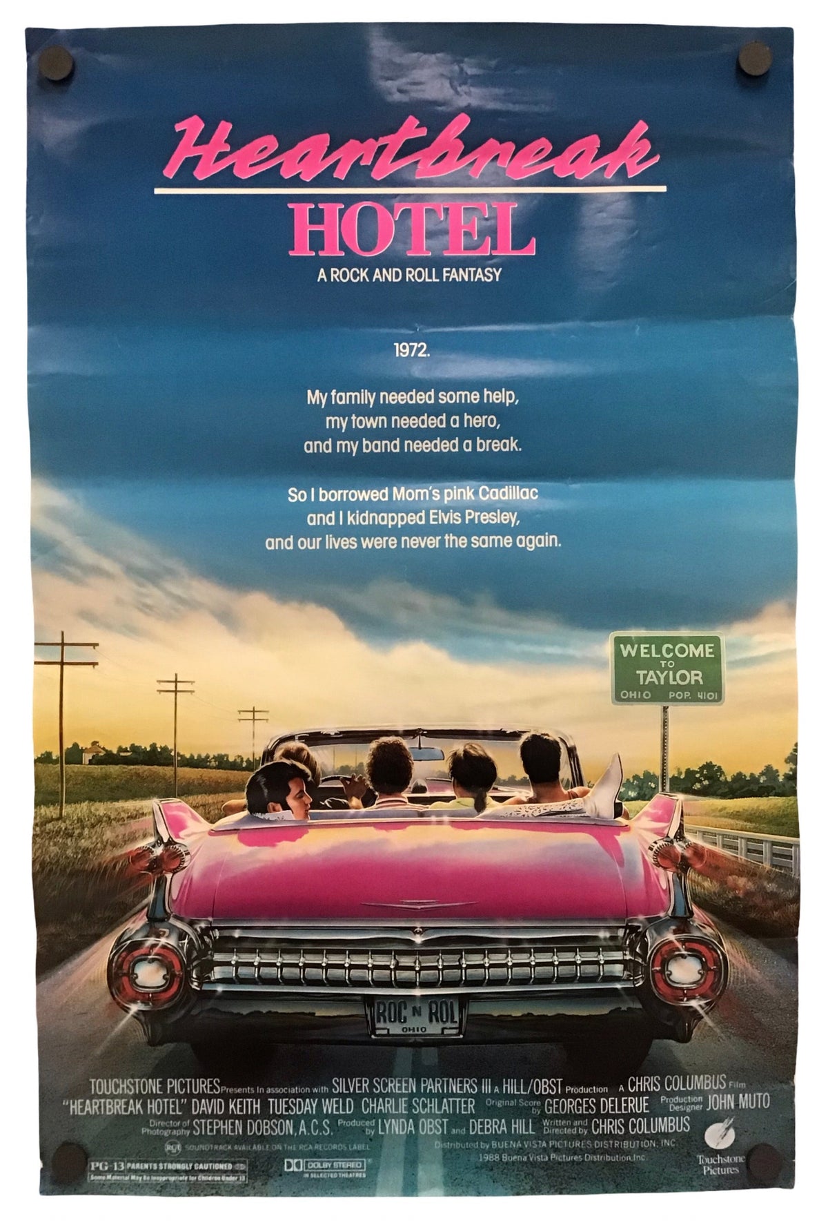 A vertical movie poster for the film 'Heartbreak Hotel' featuring a large scenic photograph of a pink convertible car on a highway at sunset, with the title in pink and white text at the top.