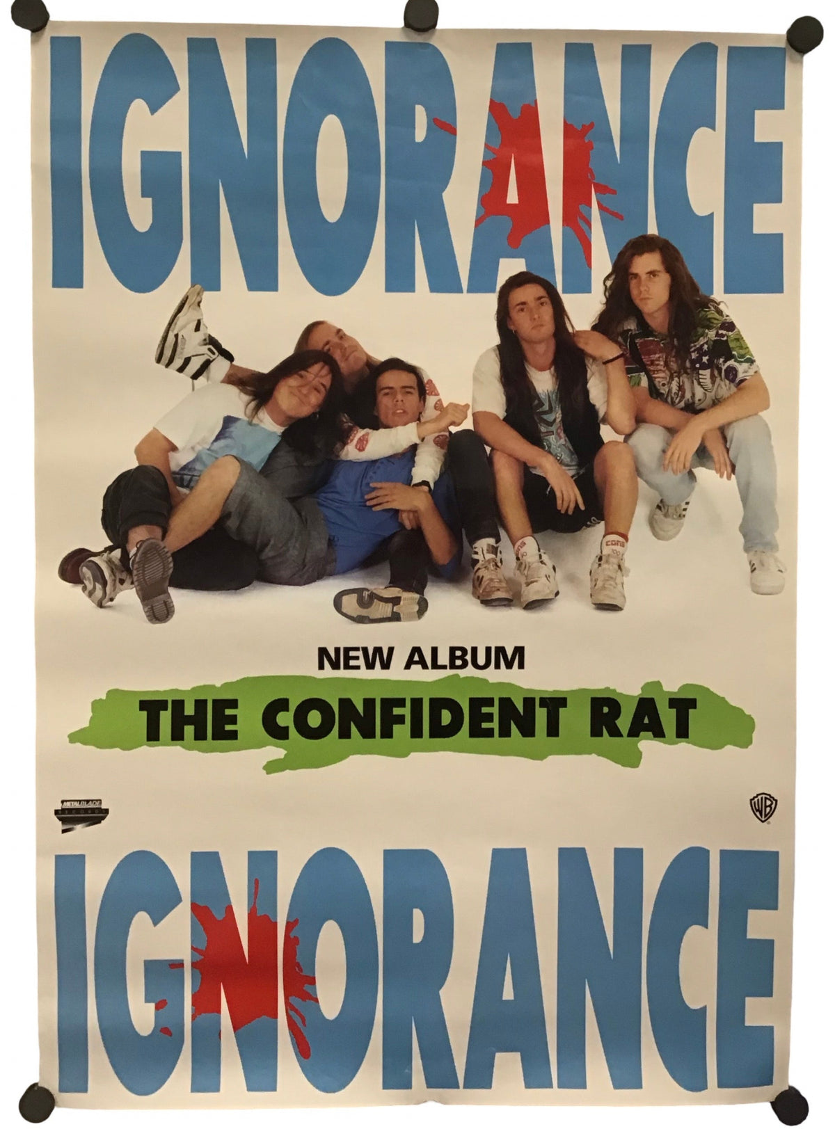 A vertical poster print for the band Ignorance's album 'The Confident Rat', featuring a group photo of the band members in the center, with the band's name in large blue letters at the top and bottom on a cream background.