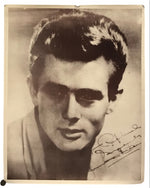 A vintage black and white portrait print of a young man, signed in the lower right corner, displayed against a plain white background.