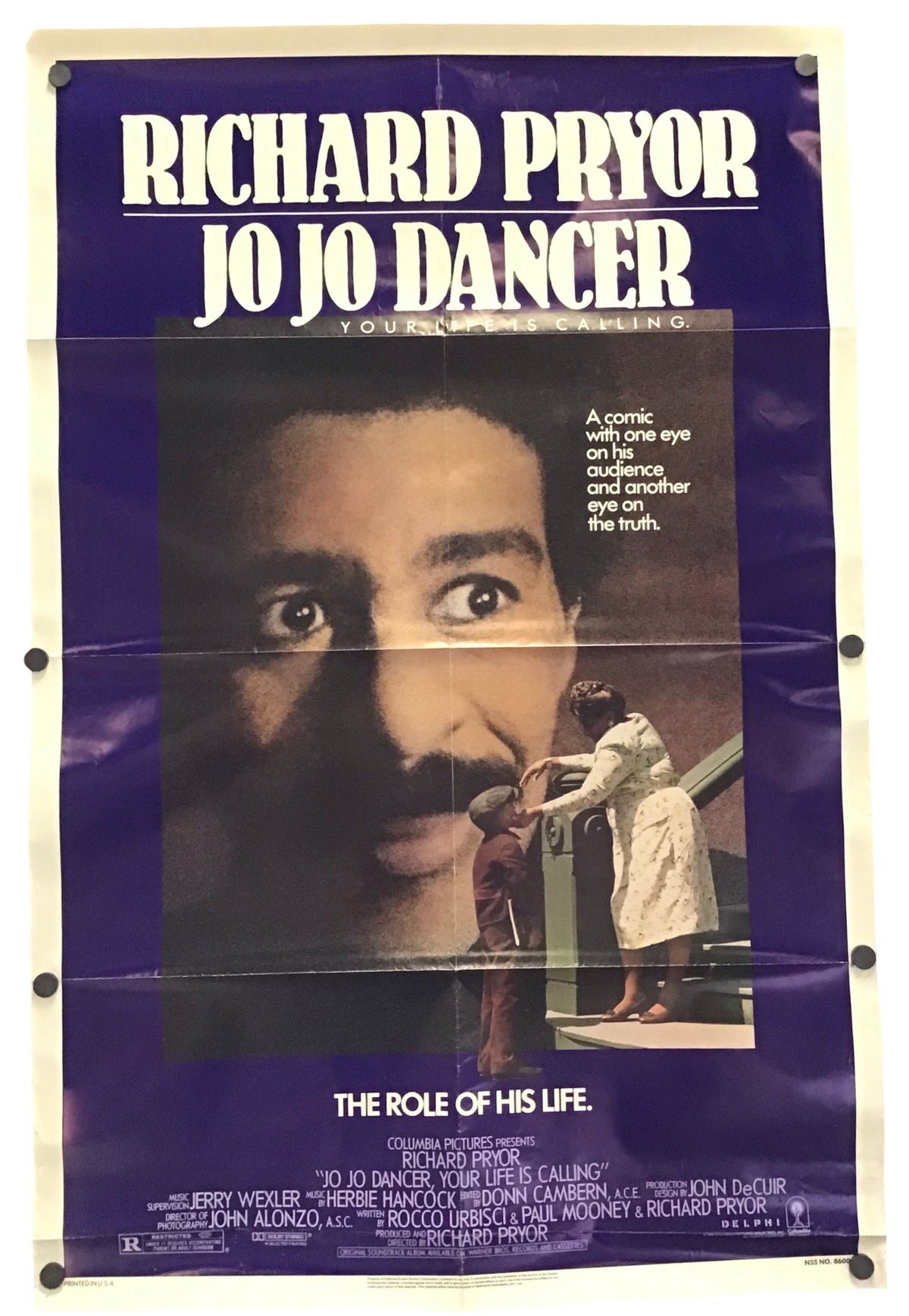 Vintage Jo Jo Dancer movie poster featuring Richard Pryor, with a purple background, large white title text, and a central close-up portrait of Richard Pryor.