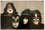 A vintage KISS band poster print featuring the four members in their signature makeup against a beige background with a faint large logo outline.