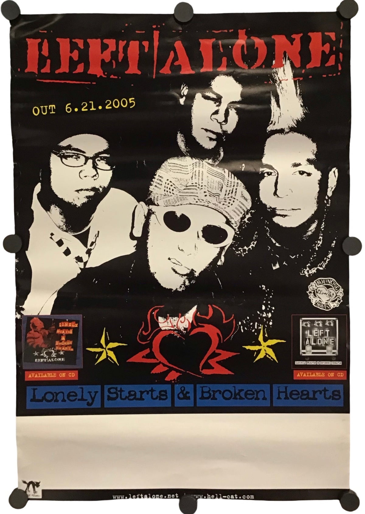A vintage-style band poster for Left Alone hangs against a plain white background. The poster is black with red, white, and blue graphics, featuring the band members' portraits and text including 'LEFT ALONE' and 'Lonely Starts & Broken Hearts'.