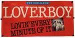 A red fabric banner featuring the text 'THE NEW ALBUM LOVERBOY LOVIN' EVERY MINUTE OF IT' in cream and black lettering, with a small black-and-white group photo on the right, shown against a plain white background.