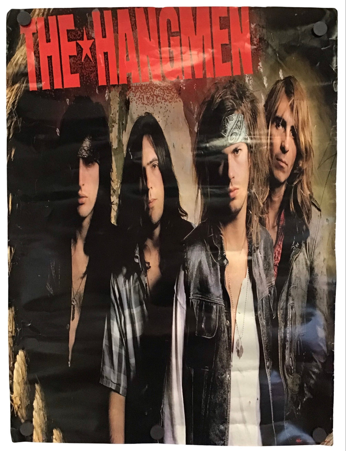 A square printed item featuring the band The Hangmen, with large red band name text across the top and four band members shown in a dark, gritty portrait layout. The item appears photographed against a plain white background.