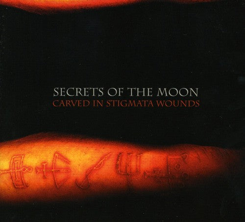 the album cover for Secrets Of The Moon - Carved in Stigmata Wounds