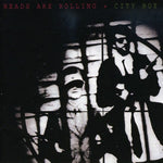 the album cover for City Boy - Heads Are Rolling