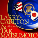 the album cover for Larry Carlton - Take Your Pick