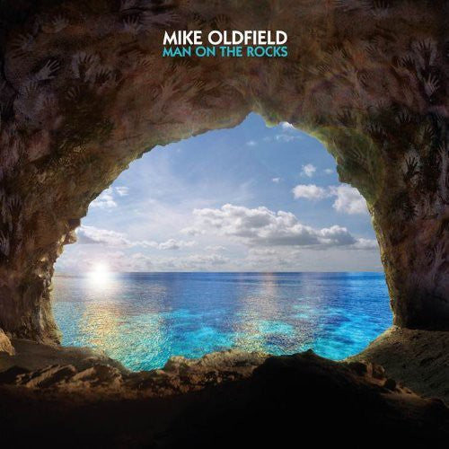 the album cover for Mike Oldfield - Man on the Rocks