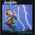 the album cover for Larry Carlton - Strikes Twice