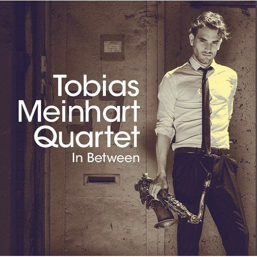 the album cover for Tobias Meinhart Quartet - In Between