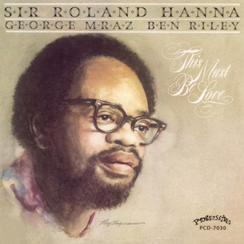 the album cover for Roland Hanna - This Must Be Love