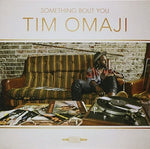the album cover for Tim Omaji - Something Bout You