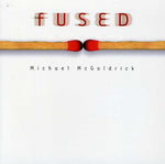 the album cover for Michael Mcgoldrick - Fused