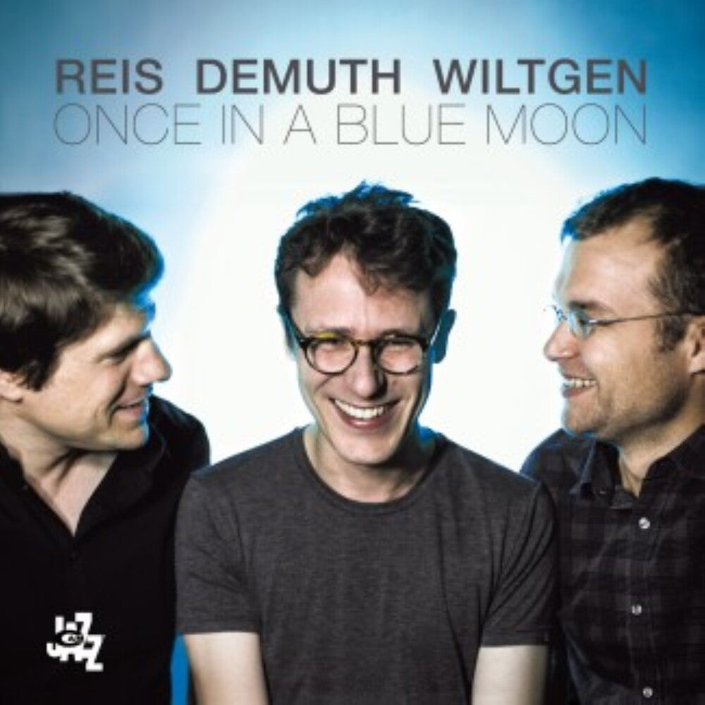 the album cover for Reis Demuth Wiltgen - Once In A Blue Moon