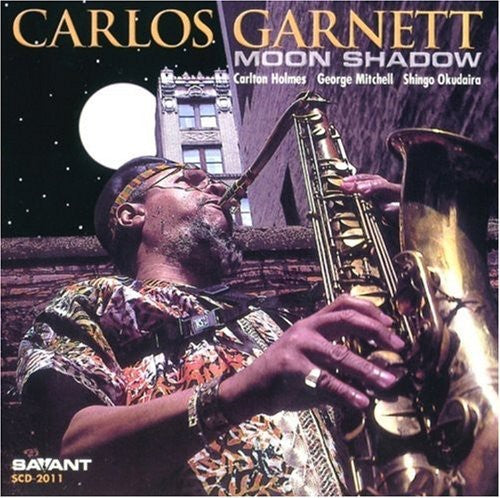 the album cover for Carlos Garnett - Moon Shadow