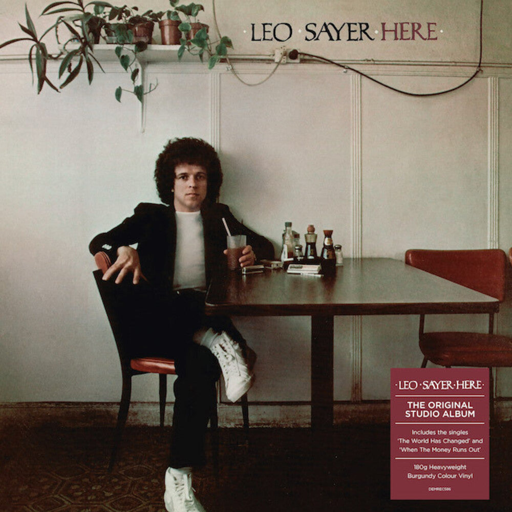 the album cover for Leo Sayer - Here [Heavyweight Burgundy Colored Vinyl]
