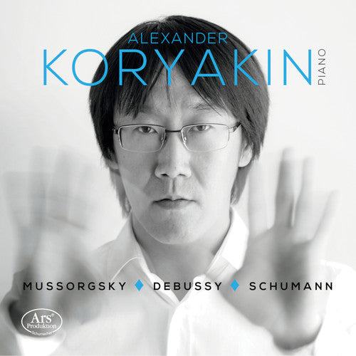 the album cover for Debussy / Koryakin - Piano Works By Debussy / Mussorgsky / Schumann