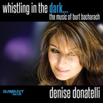 the album cover for Denise Donatelli - Whistling in the Dark... The Music of Burt Bacharach