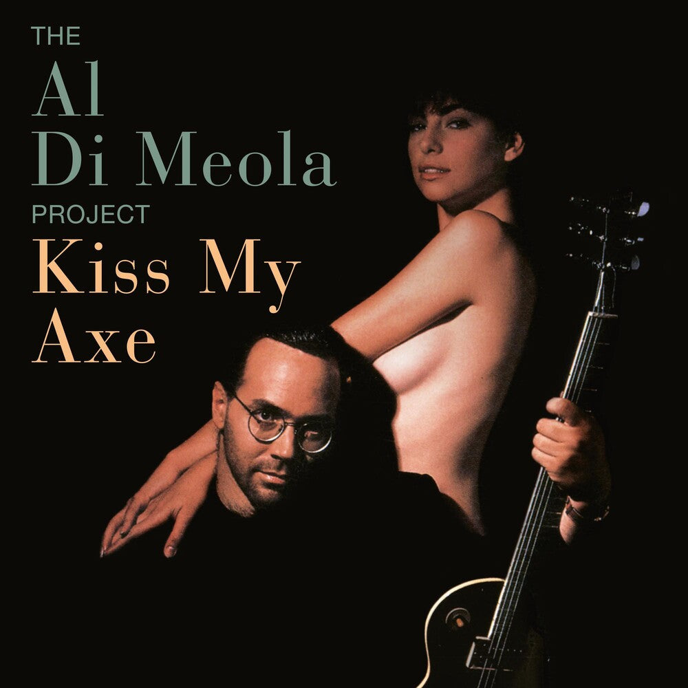 the album cover for Al Di Meola - Kiss My Axe