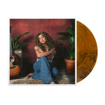 the album cover for Tori Kelly - God Must Really Love Me [Translucent Orange with Black Swirls]