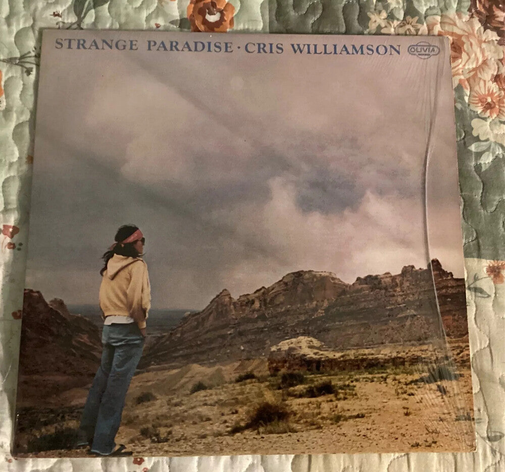the album cover for Cris Williamson - Strange Paradise [With Booklet]