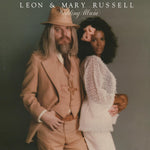 the album cover for Leon Russell - Wedding Album [Colored Vinyl] [Limited Edition] (Slv)