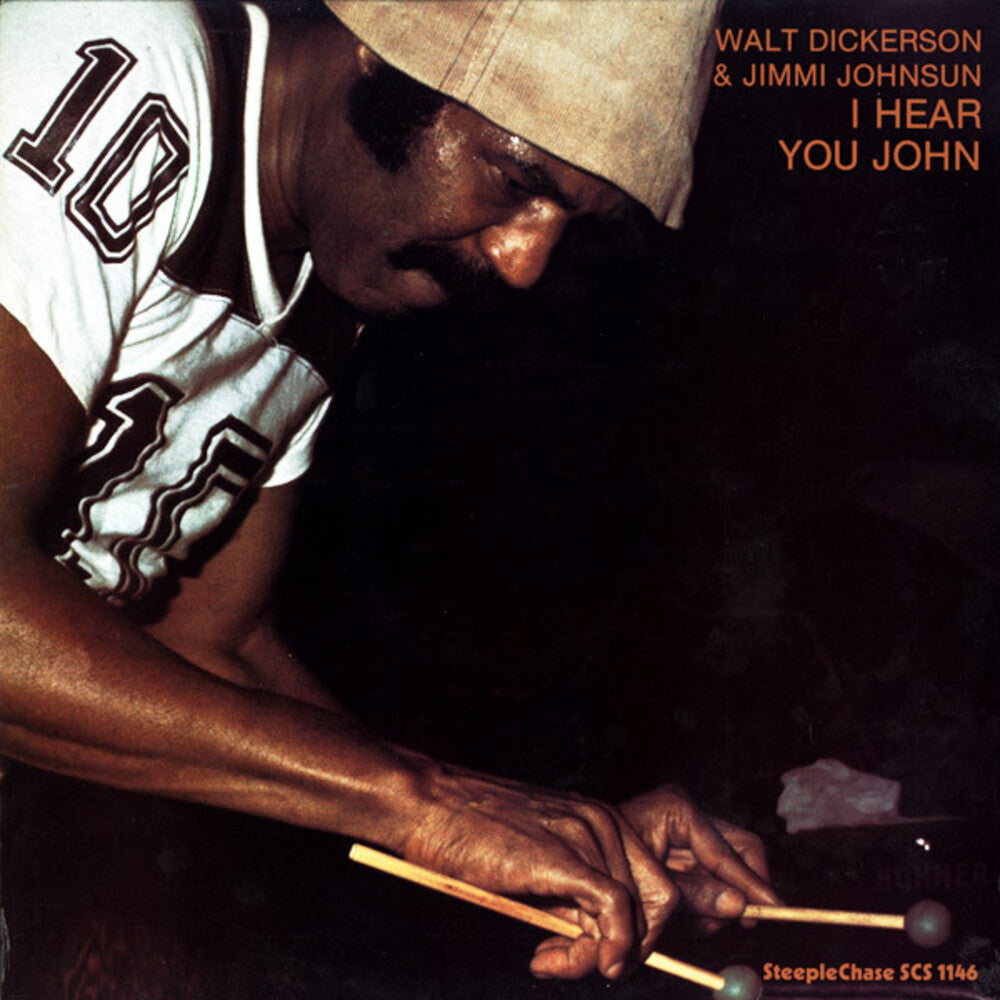 the album cover for Walt Dickerson - I Hear You John