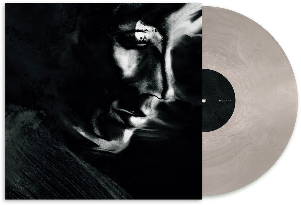 the album cover for Matthew Dear - Black City (Ghostly 25 Year Anniversary Edition) -[Transparent Silver Vinyl LP]