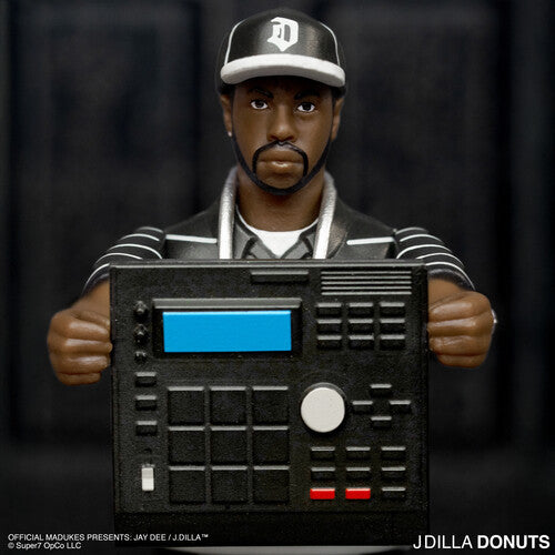 Super7 - J Dilla - ReAction Figures Wv1 - J Dilla (Donuts - Smile Album Cover)