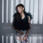 the album cover for Azumi - Here Feat. Tabu Zombie