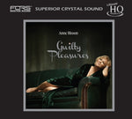 the album cover for Anne Bisson - Guilty Pleasures [Limited Edition]